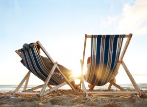 photo of a couple of chairs on the beach