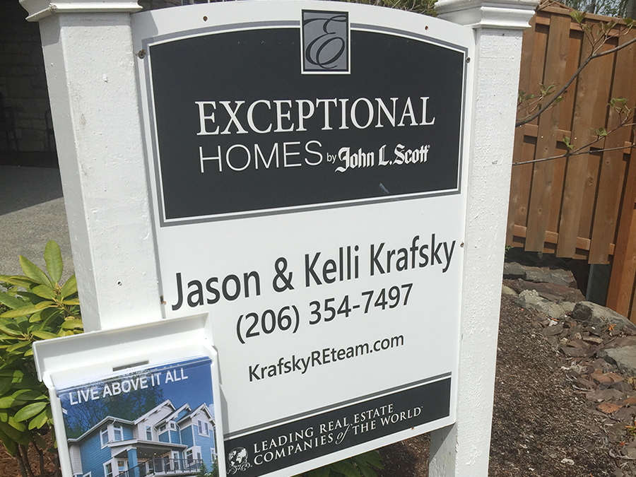 Jason and Kelli Krafsky buying a home sign