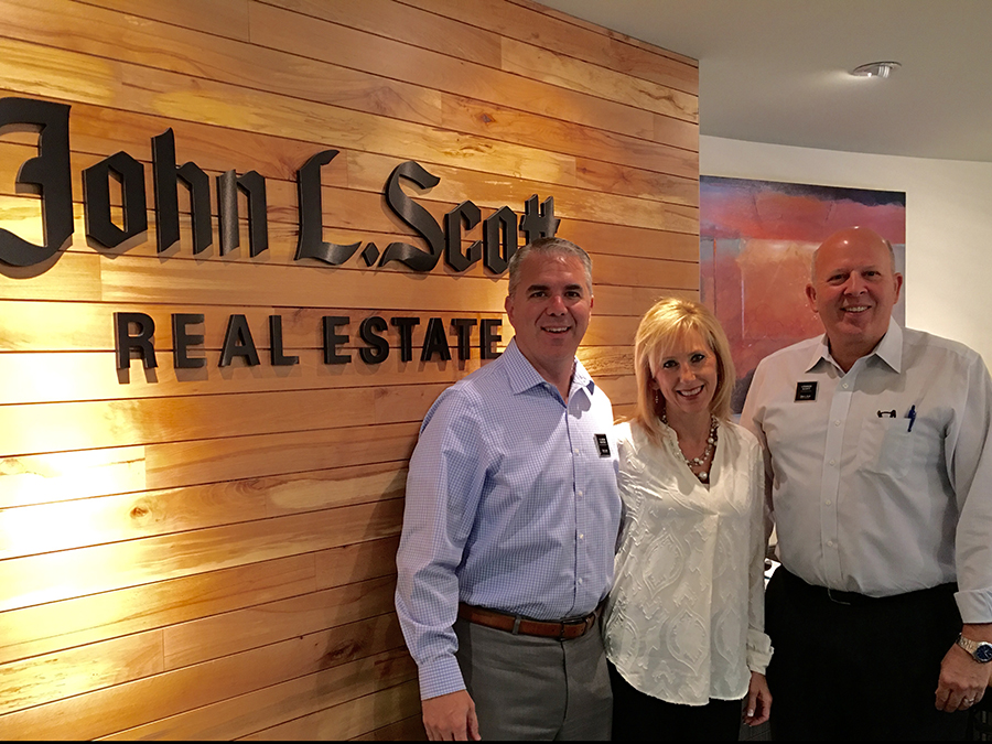 Jason and Kelli Krafsky with John L. Scott owner, Lennox Scott
