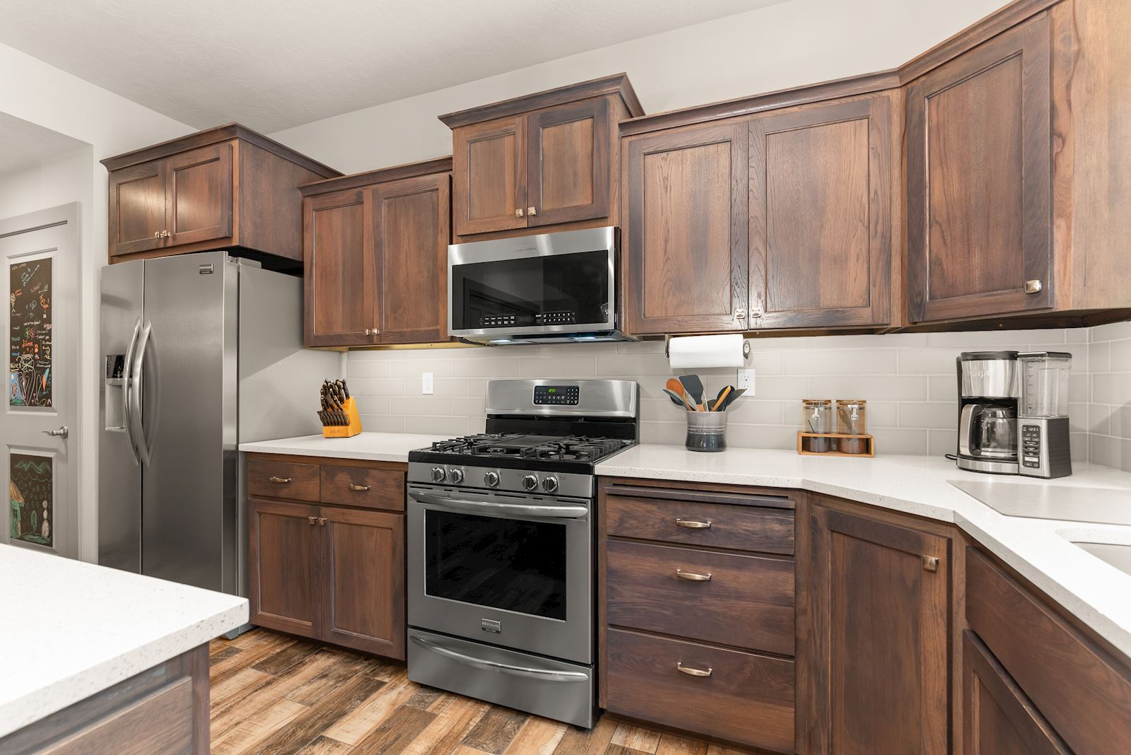Gas range and updated kitchen finishes at 7132 S Pheasant Ridge Dr in Eagle Ridge Spokane WA.