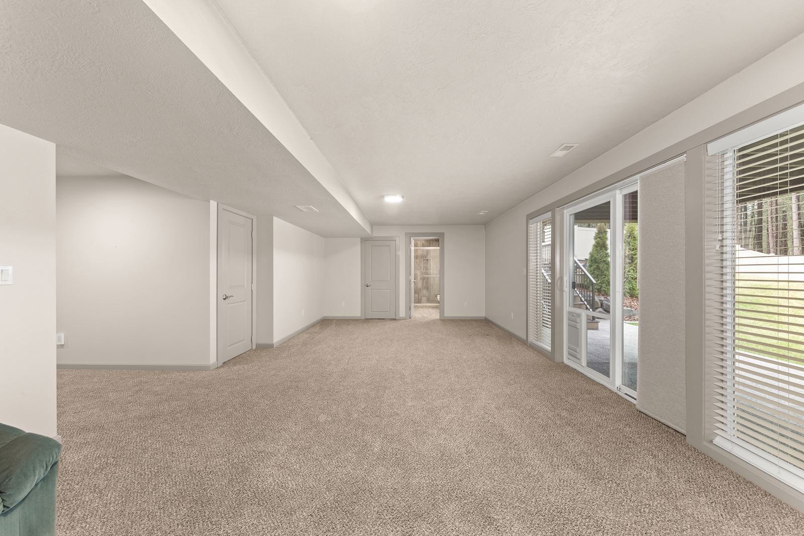 Finished daylight basement family room at 7132 S Pheasant Ridge Dr in Eagle Ridge Spokane WA.