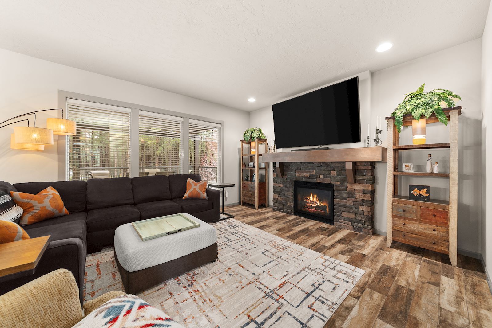 Living room at 7132 S Pheasant Ridge Dr in Eagle Ridge Spokane WA with natural light and a cozy fireplace.