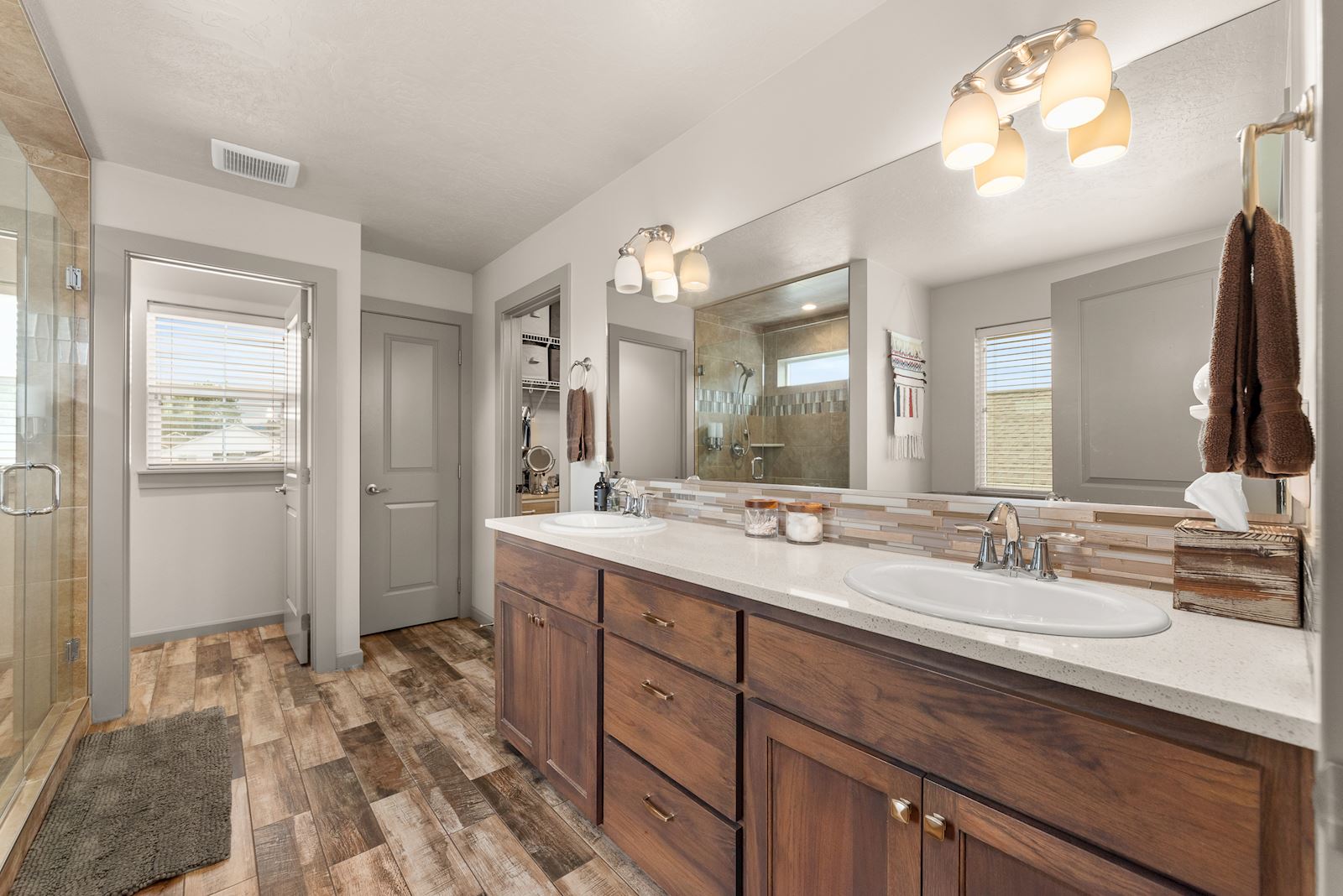 Primary suite bathroom at 7132 S Pheasant Ridge Dr in Eagle Ridge Spokane WA with double vanity.