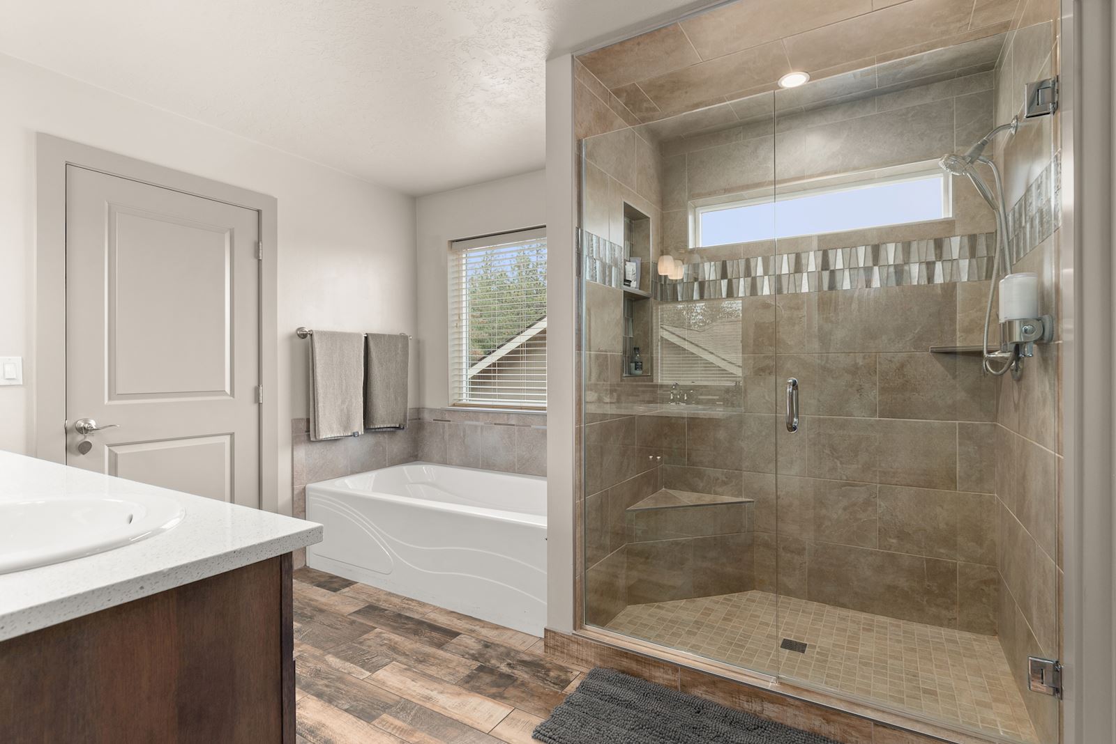 Ensuite bathroom at 7132 S Pheasant Ridge Dr in Eagle Ridge Spokane WA with soaking tub and separate shower.