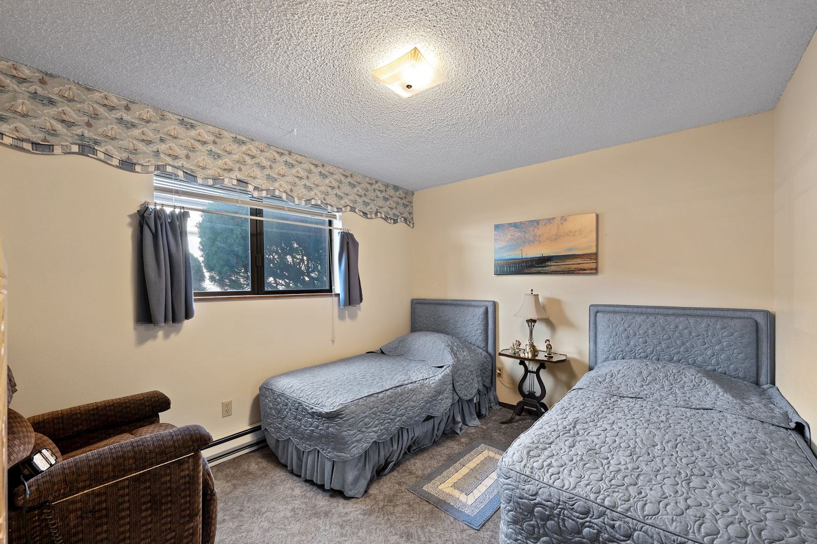 Second Bedroom at 13223 E 29th Ave Unit 2, Country Village 55+ Community, Spokane Valley WA. Listed by Team Dailey.