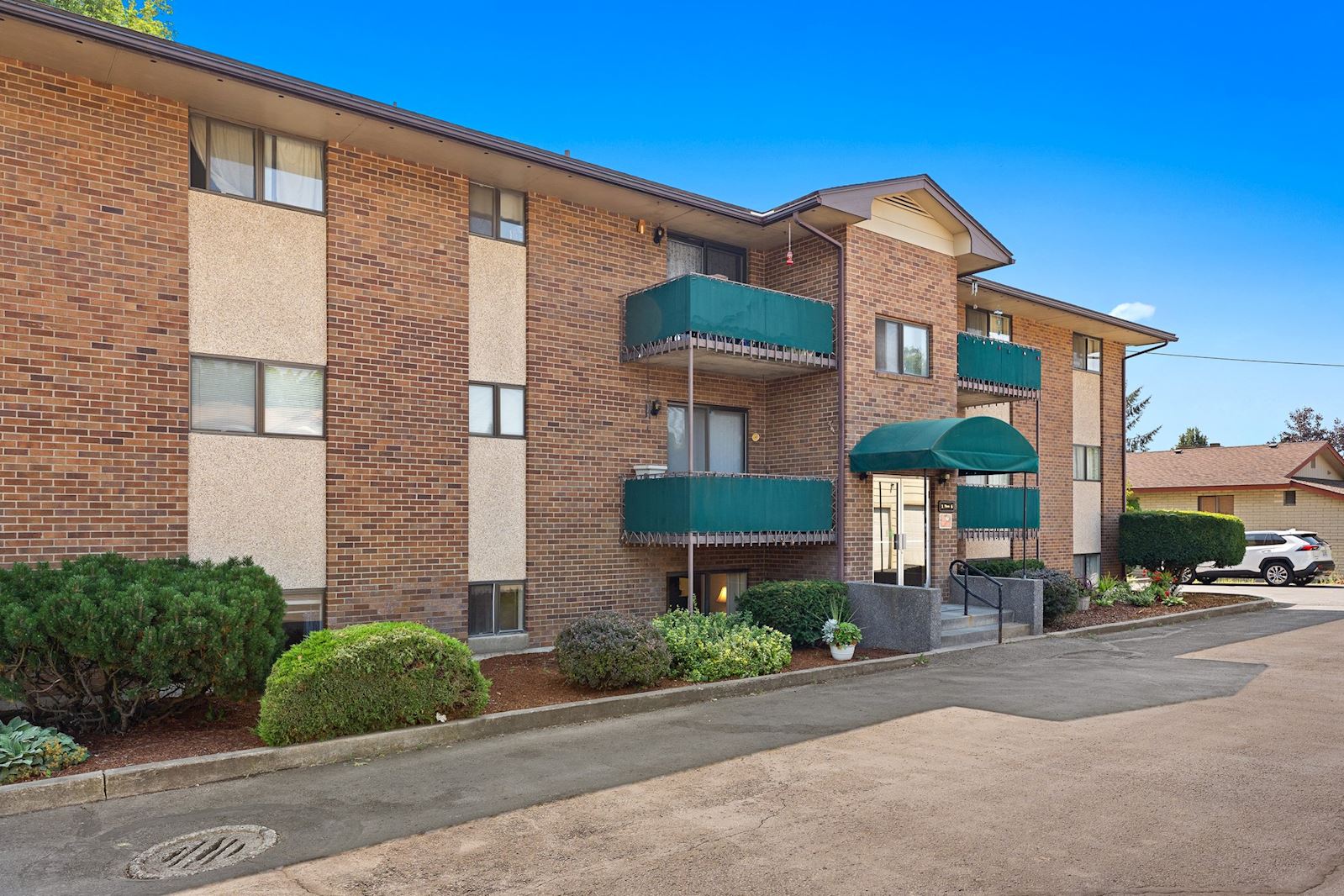 Front Doors at 13223 E 29th Ave Unit 2, Country Village 55+ Community, Spokane Valley WA. Listed by Team Dailey.