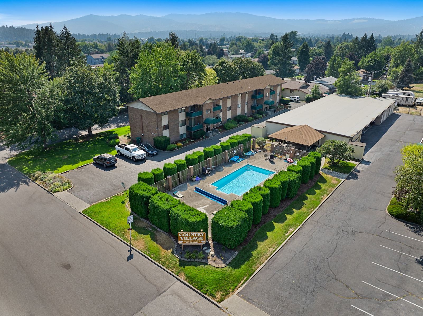 Community pool at Country Village 55+ condo 13223 E 29th Ave by Team Dailey