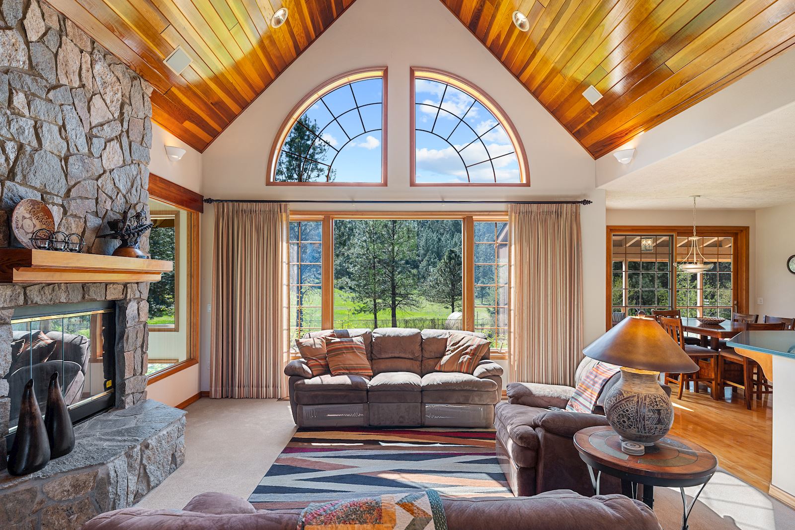 Breathtaking cedar-lined cathedral ceiling and natural light in the Nine Mile Falls custom home