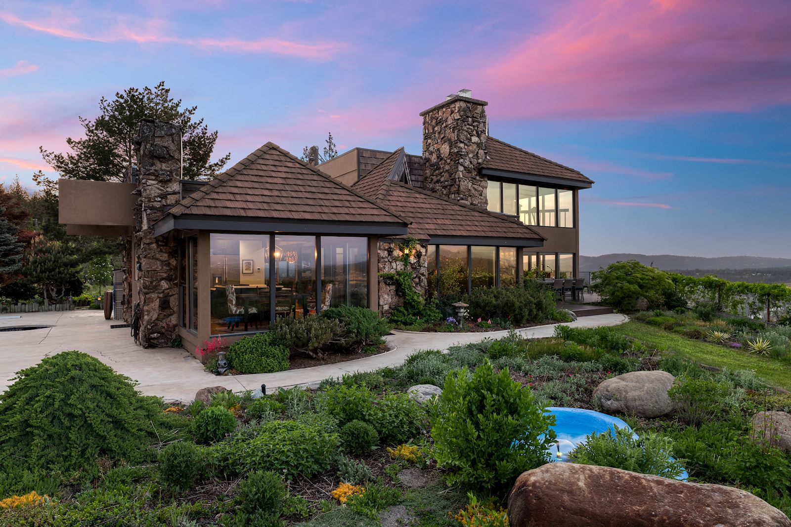 Dramatic evening twilight view of the Indian Bluff gated view property in Spokane