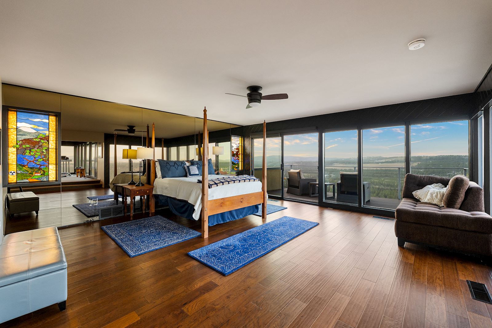 Primary bedroom suite offering expansive northern views of the Spokane landscape