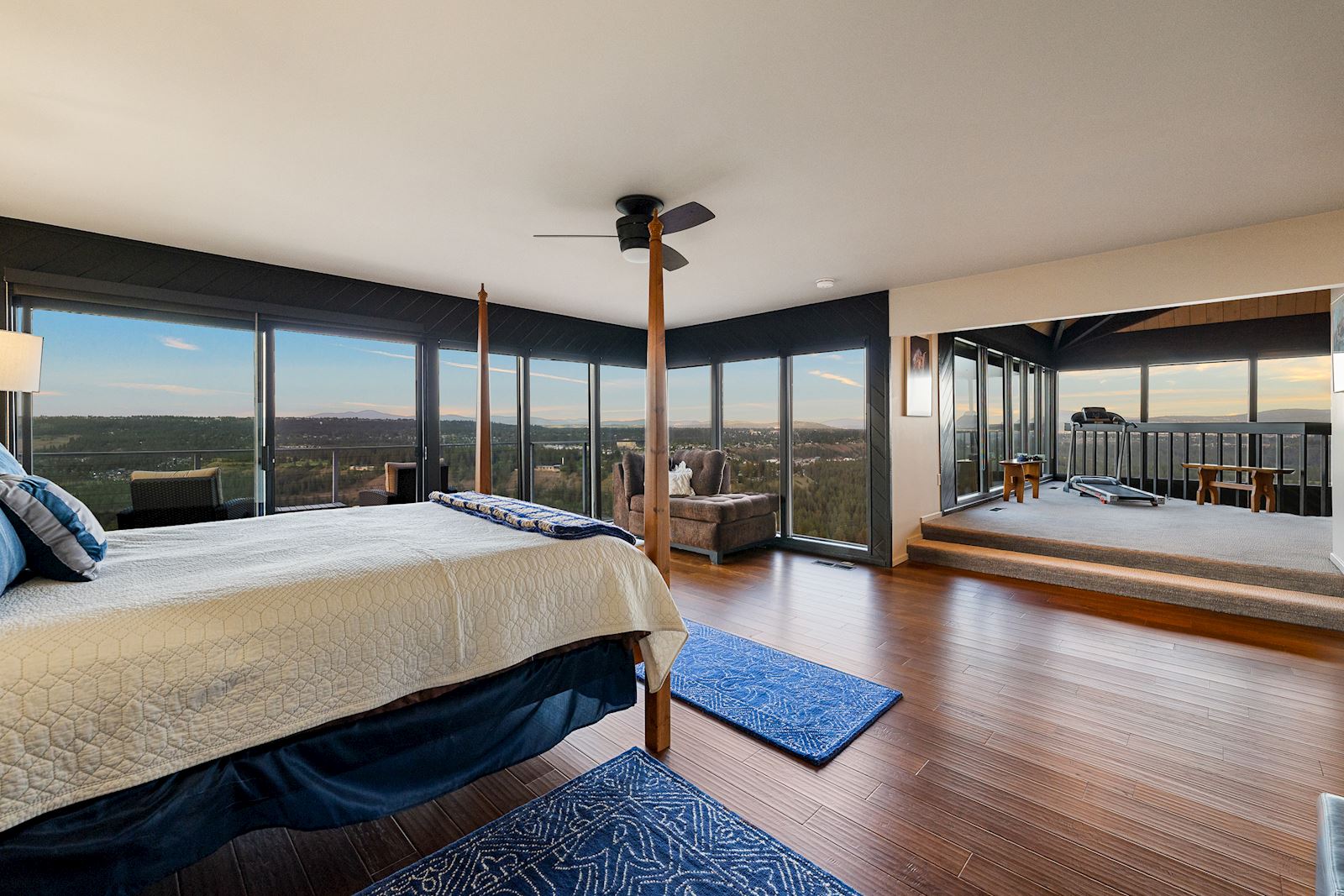 Spacious primary retreat with balcony access at the iconic Indian Bluff property