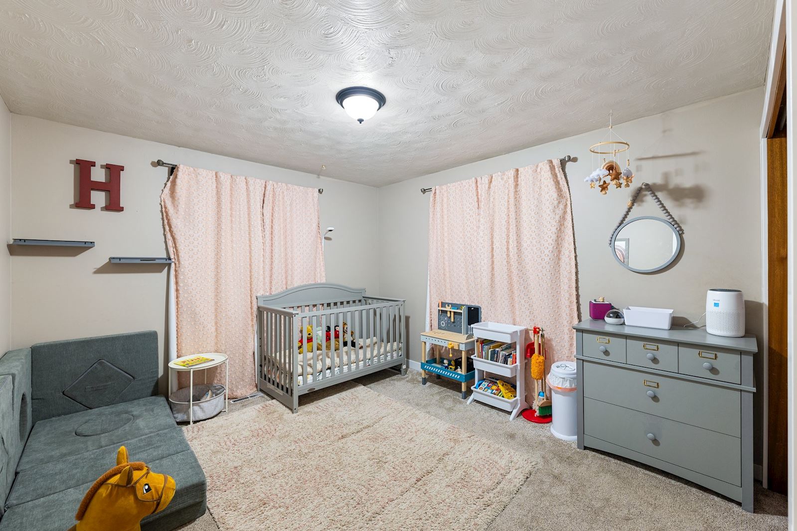 Main floor bedroom at 6516 N Hartley St in North Spokane WA 99208. Real estate listing by Team Dailey | John L. Scott Real Estate.