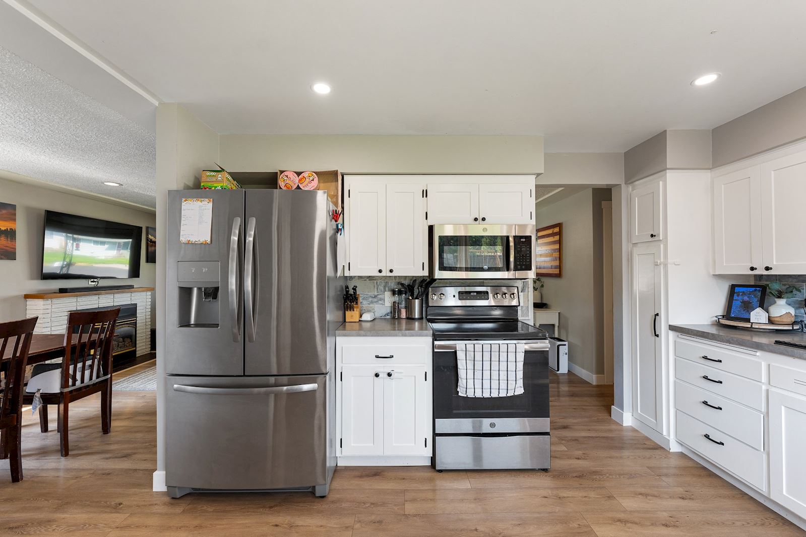Remodeled kitchen with fresh flooring at 6516 N Hartley St in North Spokane WA 99208. Real estate listing by Team Dailey | John L. Scott Real Estate.