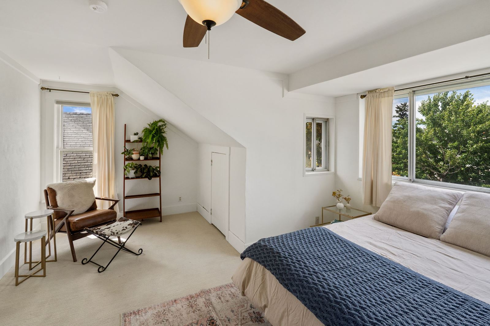Previous listing: Bedroom with sloped ceiling, large window, and a reading corner